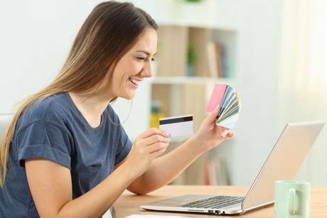 A young woman looking very happy after she got her credit builder balance transfer cards.