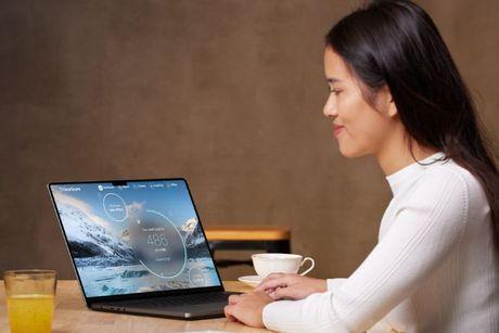 A picture of a girl looking at her laptop with ClearScore homepage on the screen.