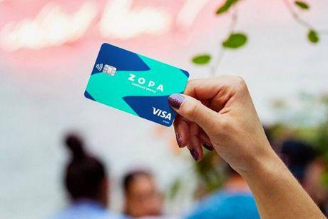 An image of someone holding a Zopa credit card.