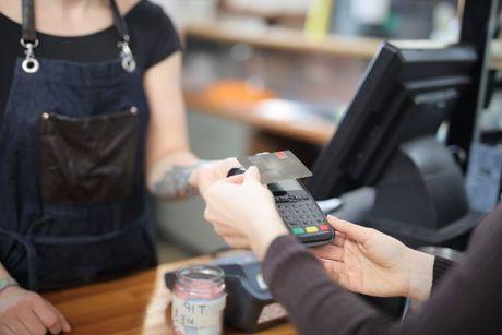 Someone paying a coffee from a phone with NFC system and the card getting declined.