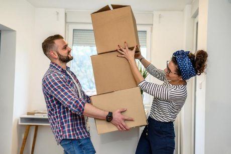 A couple moving their stuff in the boxes after rent payments.