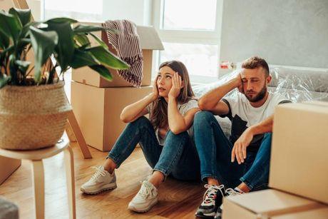 A couple looked worried and stressed after their credit score affect the mortgage