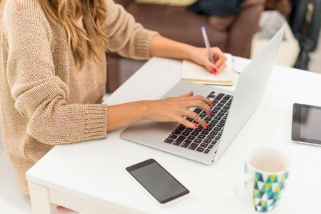 A woman sitting in front of her laptop adding a notice of correction with clearscore.