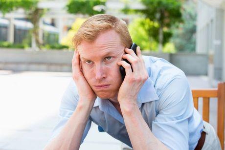 A man looked annoyed on his phone call after cancelling his mobile phone contract.