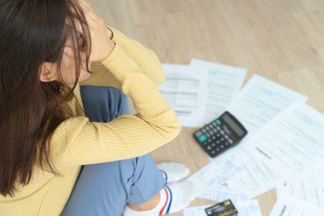 An image of a young woman feeling stressed after a mortgage application checks.