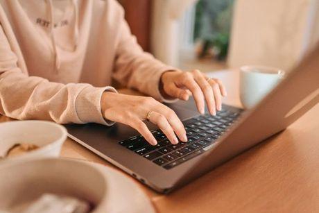 Woman searching about credit reference agencies on her laptop.