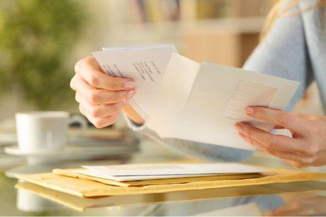 An image of a woman looking at her experian statutory credit report.