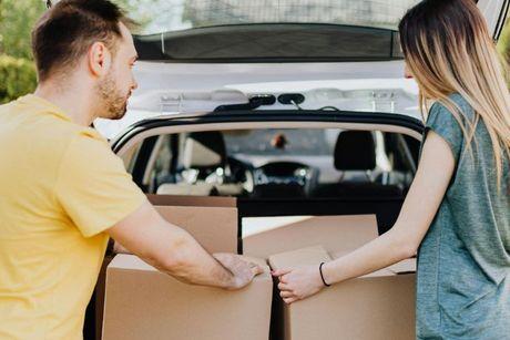 A couple in the UK moving their stuff from a car to a new home after getting a tracker mortgage