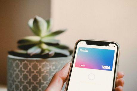 An iPhone showing a Revolut card inside the Apple Pay wallet.