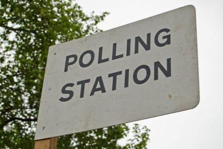Sign pointing towards a polling station in the UK, where some EU citizens also have the right to vote