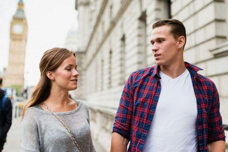 Young European couple with pre-settled status walking in London.