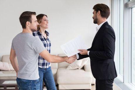 A couple making a deal with a mortgage for renting a new house.