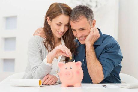 An image of a couple saving their money on a piggy bank.