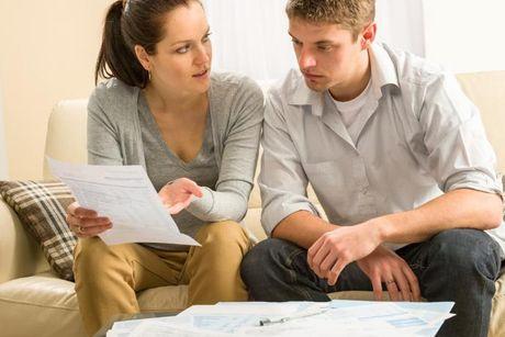 An image of woman looking at a documents and explaining to her partner about the lowest APR payday loans for bad credit.