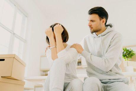 An image of a couple looking stressed because of potential identity fraud and affecting their mortgage.